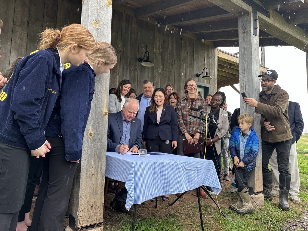 Governor Tim Walz signing the 2023 Omnibus Ag Budget at Hannah Bernhardt’s farm